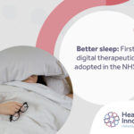 Better sleep: First digital therapeutic adopted in the NHS. Includes image of woman in bed with head under pillow, hand outside duvet holding glasses